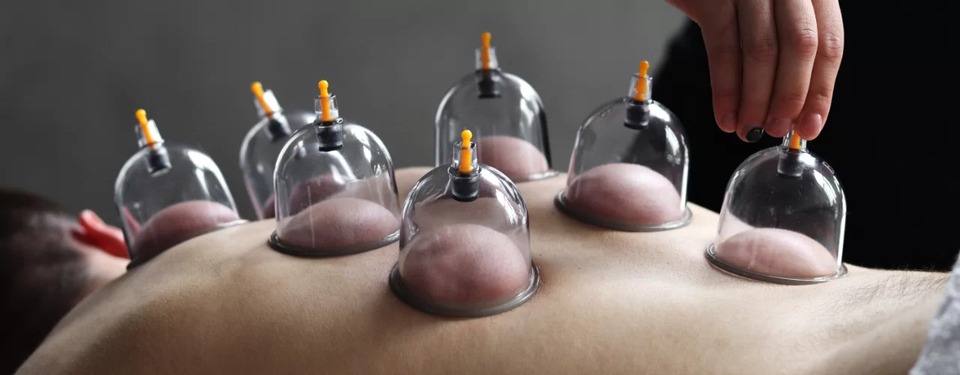 Silicone cup applied to the upper back for decompression
