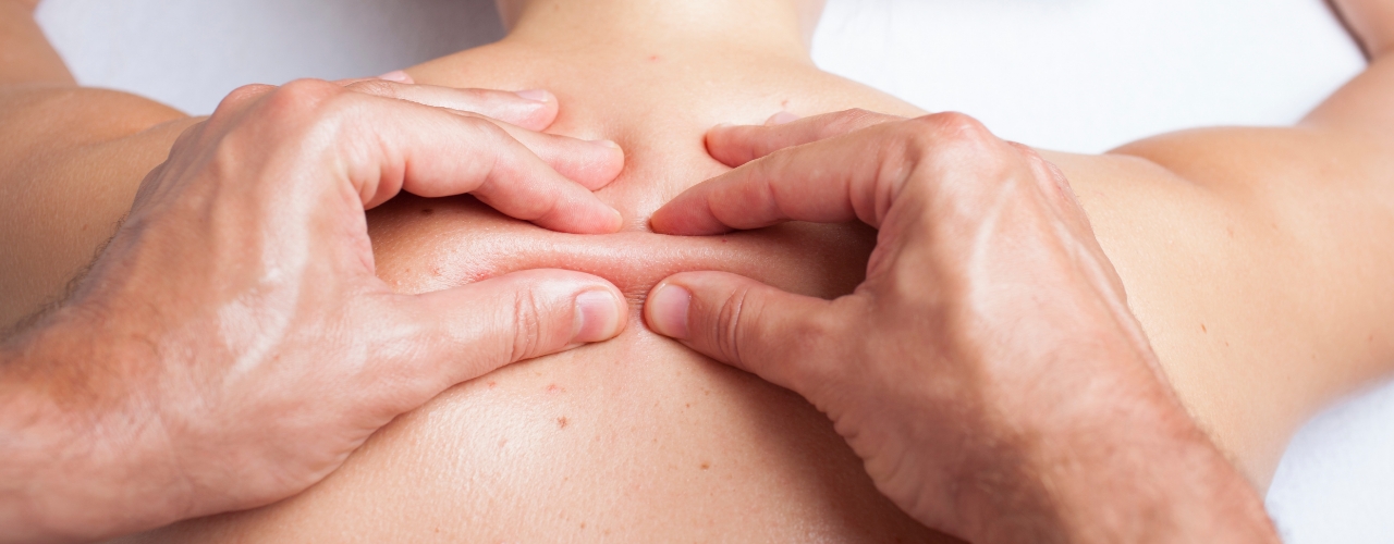 Myofascial release applied to shoulder and upper back