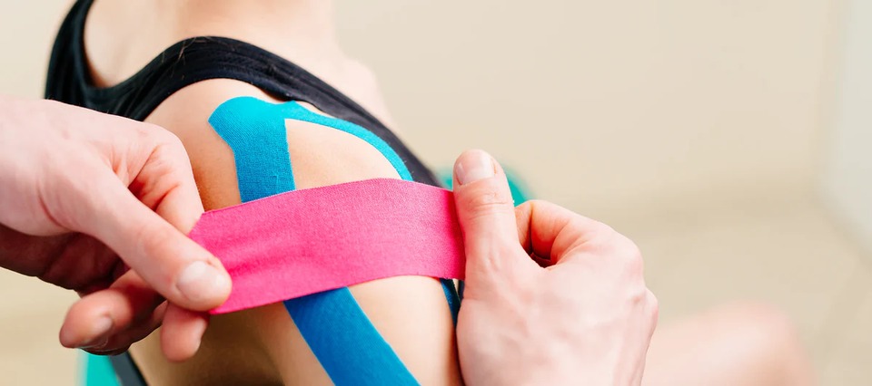 Kinesiology taping applied to the shoulder for support and cueing